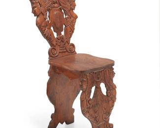 125
An Italian Renaissance-style carved wood sgabello chair
19th/20th century
Carved with masks and winged figures and a scrolled crest
39.5" H x 16" W x 17.5" D
Estimate: $300 - $400