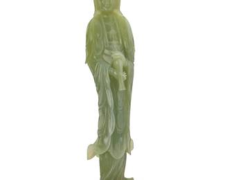 184
A Chinese carved jade figure of Guanyin
20th century
Set on a carved wood stand
Jade: 18.375" H x 4.375" W x 4.375" D; Stand: 1.625" H x 5.875" W x 4.25" D
Estimate: $600 - $800