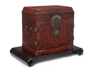 225
A Chinese hardwood seal chest
Late Qing Dynasty (1644-1912) or later
Possibly carved Huanghuali wood, the chest with brass latch lock, hinges, and opposed handles, featuring a hinged top above two cabinet doors revealing four drawers, set on a carved wood stand
Box: 12.5" H x 12.5" W x 9.25" D; Stand: 2.25" H x 19.25" W x 11.375" D
Estimate: $4,000 - $6,000
