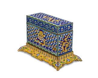 214
An Asian cloisonné lidded box
20th century
Depicting dragons within a cloud pattern on blue ground and floral trimming, set in a yellow-ground floral motif stand
8.5" H x 11.25" W x 7.25" D
Estimate: $400 - $600