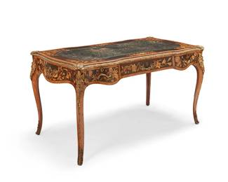 28
A Victorian Louis XV-style marquetry bureau plat
19th century
The locks marked: [crown] VR / W & H / Patent
The inset leather top with blind-stamped border, throughout decorated with profuse floral motif marquetry and gilt-bronze mounts of floral trimming, foliate pulls and locks, and masks at corners, featuring a locking drawer centering two smaller drawers to one side, the other side with matching false-fronts
29.5" H x 54.5" W x 31" D
Estimate: $1,000 - $1,500