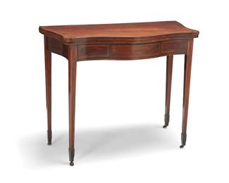 349
A George III mahogany fold-over games table
Late 18th/early 19th century
The single-drawer table with folder-over top revealing a green felt-lined surface, resting on two gate legs, each leg raised on casters
29.5" H x 36.25" W x 18" D
Estimate: $400 - $600