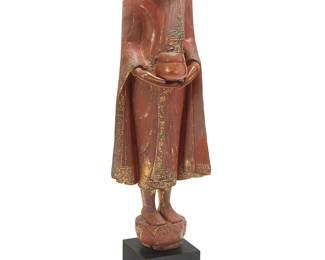 207
A Southeast Asian lacquered carved wood donor figure
Likely Thailand, Rattanakosin Period (1782-1932)
Decorated with gilt accents and inset glass, set on an ebonized wood plinth
Figure: 40.75" H x 14.25" W x 9.75" D; Overall: 47.5" H x 14.25" W x 11.75" D
Estimate: $800 - $1,200