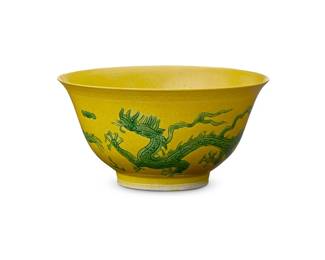 65
A Chinese yellow ground porcelain dragon bowl
Late Qing Dynasty (1644-1912) or later
Bearing a reign mark for Guangxu Period (1875-1908)
The footed bowl with green enameled dragon and flaming pearl motifs to exterior and a crane to interior
2.625" H x 5.125" Dia.
Estimate: $1,000 - $1,500