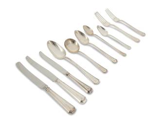 373
A Durgin sterling silver 'Fairfax' flatware service
Early 20th century, retailed by Spaulding & Co.
Each marked: Spaulding & Co. / [Durgin cipher] / Sterling / Pat'd
Comprising 12 place knives (9.75"), 3 place knives with different blades (9.75"), 4 dinner knives (8.75"), 9 dinner forks (7.875"), 12 salad forks (7.25"), 12 cream soup spoons (6.875"), 12 oval soup spoons (7.125"), 10 teaspoons (5.75"), 5 iced tea spoons (7.5"), and 3 serving spoons (8.5"), personalized
82 pieces
Total weighable sterling: 100.7 oz. troy approximately
Estimate: $2,000 - $4,000