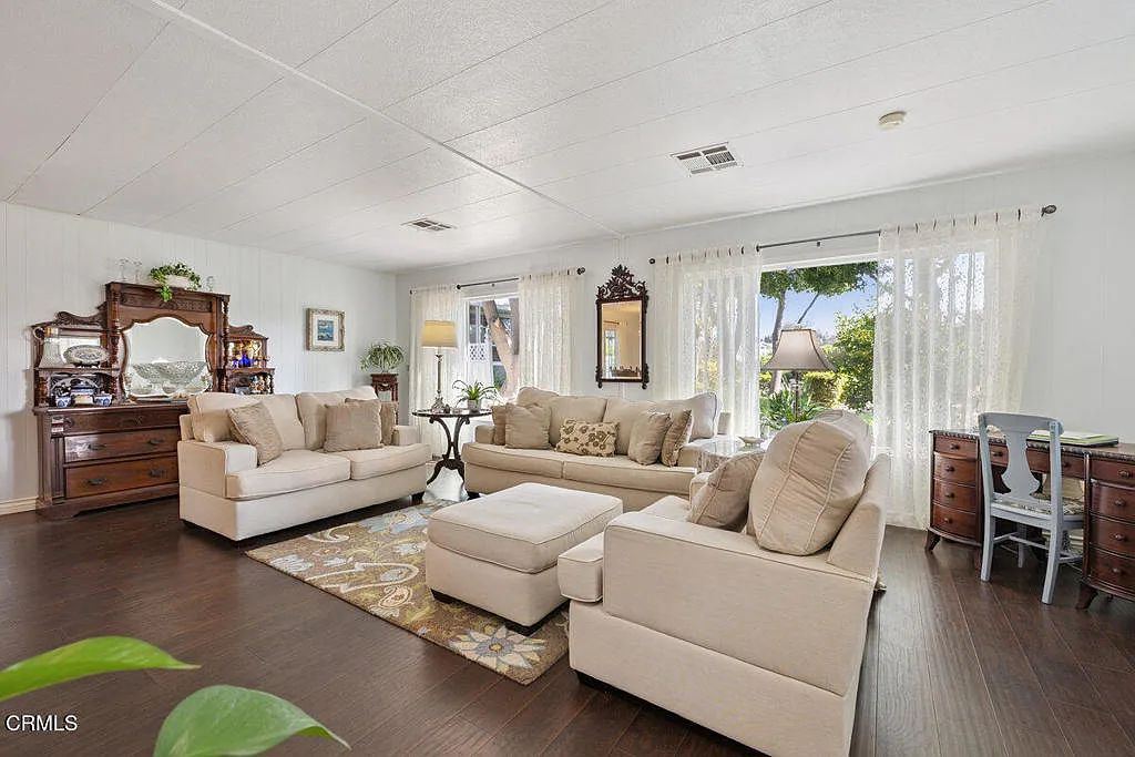 Living room set: Queen sleeper sofa, love seat, chair, and ottoman
5’ x 7’ 100% wool area rug
Antique mahogany desk
Tall barbered Plant stand
Blue painted chair