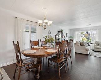 Oak extendable dining set with six pressed back chairs