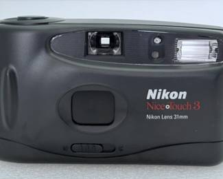Nikon Nice Touch 3 35mm Point & Shoot Film Camera. Brand new inbox with instructions, plastic and carrying case.