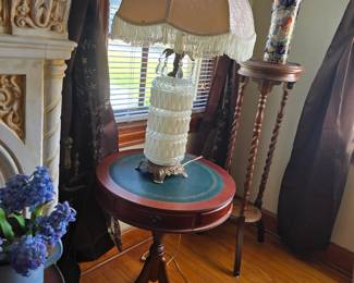 vintage lamp on antique mahogany drum table with leather top and 3-drawers