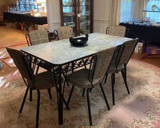 midcentury cat iron table with 6 chairs and 1 leaf
