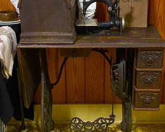 antique National B Eldredge Automatic sewing machine in oak cabinet with box cover. Late 1800's - early 1900's