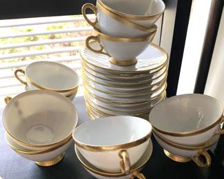 midcentury gold and white coffee cups and saucers