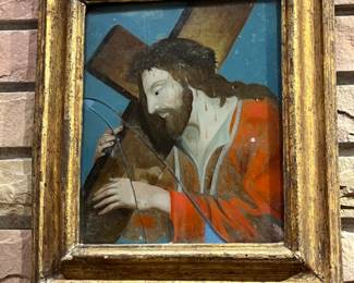 very old reverse painted glass depicting Jesus carrying his cross - in beautiful antique frame - some damage to painting but secure under glass frame