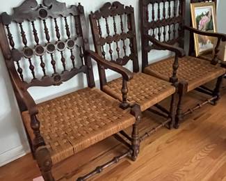 antique very old Italian wood chairs with woven seats