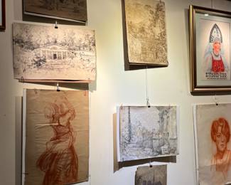 a gallery wall full of original art - most by Polish born Ekaterina Falileewa and her artist husband Russian born Vadim Falileev (Falileef)