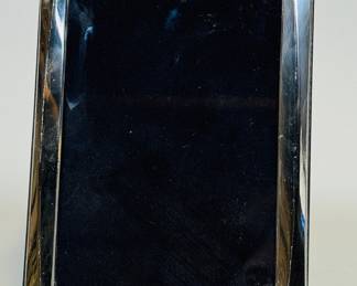 American Sterling Silver Rectangular 4x6 Photo Frame. Stamped on bottom of frame: 925
CONDITION: scratches to frame