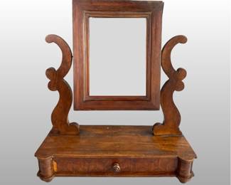 Late Empire Style Dresser Mirror Or Shaving Stand, 20th Century. H: 21 x w: 18 1/2 x d: 7 1/4 inches
CONDITION: Losses to the veneer at the side of the drawer and peeling veneer at the top of the mirror