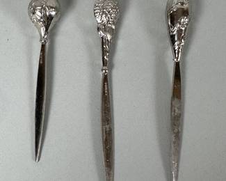 Three Sterling Silver Cocktail Picks, each with floral repousse designs, each stamped STERLING, Length: 3 1/4 inches