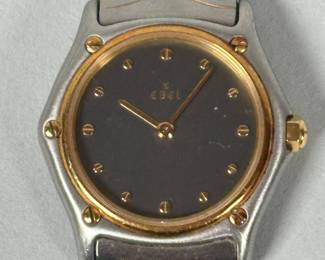 Ebel "Classic Wave" Two Tone Woman's Wrist Watch The two tone stainless steel strap with gold hands and indices, steel toned dial, Dia.: 25mm (face), Length overall: 6 3/8 inches.
CONDITION: minimal signs of use or wear.