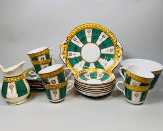 Continental Porcelain Part Tea Service, 19th Century (21), all unmarked, in green ivory and yellow, unmarked
1 - jug, H: 5 inches
1 - biscuit dish, H: 3 1/4 inches
1 - under tray, Dia: 10 inches
6 - tea cups, H: 2 3/4 inches
6 - saucers, Dia.: 6 1/4 inches
6 - finger bowls, Dia.: 5 1/2 inches
CONDITION: jug yellowed and wear to gilt, cup cracked