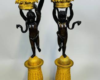 Pair Of Fine French Empire Parcel-Gilt Bronze Cassoulets, 19th Century. H: 19 3/4 x w: 4 x d: 5 inches
CONDITION: wings loose on one figure, areas of oxidation to gilding