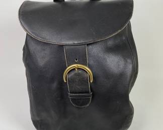 Vintage Coach Black Leather Backpack. with two adjustable straps, H: 17 1/2”, w: 11”, d: 5”
CONDITION: some scratching to sides and bottom