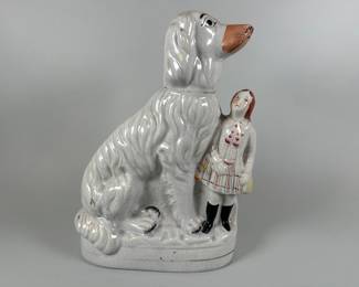 Victorian Staffordshire Flat Back Figure Of An Afghan Hound With Boy. H: 12 1/2 x w: 10 inches
CONDITION: Crazing, areas of wear to paint and gilt highlights.