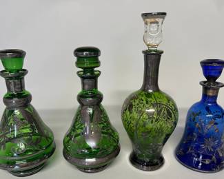 Continental Colored Glass Decanters With Silver Painted Floral And Foliate Motifs (4), all unmarked, two are a pair, H: 9 1/4 x w: 4 1/2 x d: 4 1/2 inches