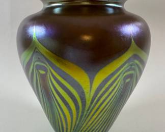 Loetz Type Favrile Glass Peacock Vase, C. 1915. with spurious LCT Tiffany Studios etched mark to underside H: 8 1/4 x w: 7 inches
CONDITION: some water lines and light calcification to interior from being used as a flower vase