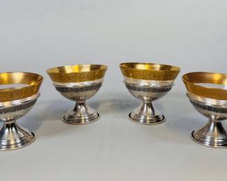 Set Of 4 Dessert Glasses With Sterling Silver Bases. 2.4 ozt, H: 3 1/2, dia.: 3 1/2 inches
CONDITION: one partially detached from base, another with dent to side
