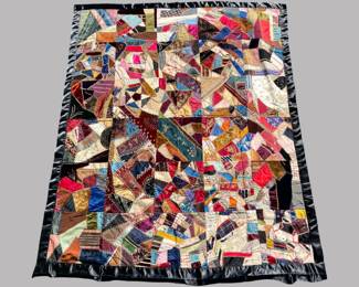 Antique Square Crazy Quilt, Probably From New York, C. 1894. With black sateen border, two panels stitched with dates 1873 and 1894, several panels with initials, with panel from a reused sugar sack from New York, 63 1/4 x 52 3/8 inches
CONDITION: areas of thinning/wear to silk and wool fabrics, sateen border probably later addition