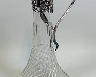 Art Nouveau Cut Crystal And Silver Metal Mounted Claret JugUnmarked, h: 12 inches
CONDITION: hinge is loose
