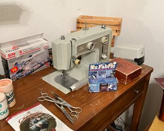 Sears Sewing Machine, electric pencil sharpener a singer handy stitch, hair scissors and thinning scissors and vintage powders.