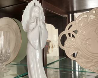 White Cereamic Statue of Woman with Flowing Dress