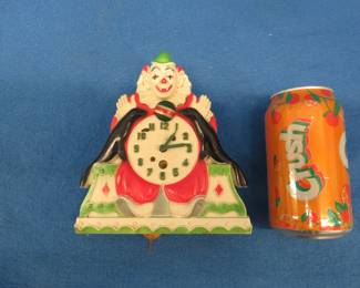 Lot 180. Circus-themed Lux clock for parts or repair