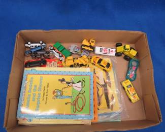 Lot 192. Old toy cars and vintage children's books