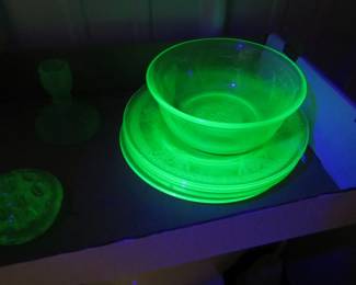 Lot 295. Uranium glass including plates, a flower frog, and more