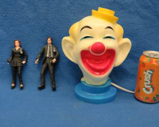 Lot 177. Clown lamp and X-Files figurines of FBI Special Agents Fox Mulder (David Duchovny) and Dana Scully (Gillian Anderson)