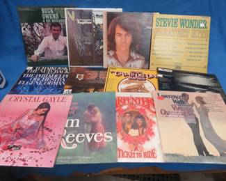 Lot 220. 12 LPs including Buck Owens, Jim Reeves, Merle Haggard, Neil Diamond, Stevie Wonder, and more