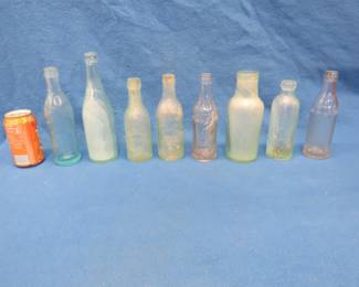 Lot 80. Eight old bottles recovered from a Minnesota lake bottom