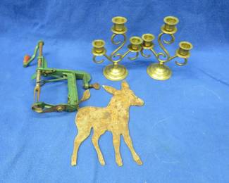 Lot 202. A pair of brass candle holders, vintage apple peeler, and a metal donkey