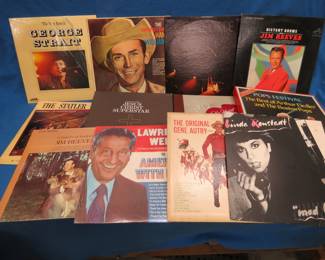 Lot 238. 12 LPs including George Straight, Jim Reeves, Hank Williams, Charlie Pride, Lawrence Welk and two multi-record symphony sets