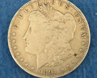 Lot 21. 1891 O Morgan silver dollar