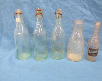 Lot 294. Vintage bottles including one from Flour City Bottling and a milk bottle from Superior, WI
