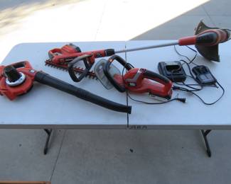 Lot 167. Battery-operated John Deere? weed whip, hedge trimmer, and blower with two batteries and two chargers.