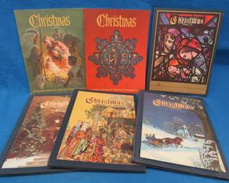 Lot 139. Six Christmas Annuals published by the Augsburg Publishing House. Antique and collectible reference and price guide books. Wicker picnic basket & CDs.