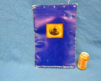 Lot 215. North Dakota limited edition photo album. Includes 20 photos.