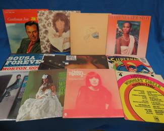 Lot 221. 12 LPs including, Jim Reeves, Merle Haggard, Linda Ronstadt, Whitney Houston, and more