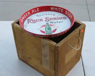Lot 55. Vintage collectibles including a Rock Spring Water tray, caps, wooden box, smoke bomb, live blank ammo, two live 35 Rem rounds, and more.