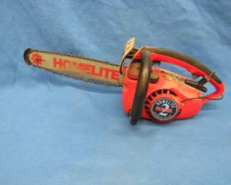 Lot 77. Homelite Super 2 Textron chainsaw. Has compression but rope does not fully recoil.